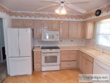 Bleached Oak Kitchen Cabinets All Appliances and Corian Counter 