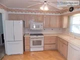 Bleached Oak Kitchen Cabinets All Appliances and Corian Counter 