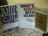 2 books w a translation of THE QUR AN and a book about ISLAM. 32