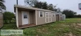Cabin with a corner porch storage building 12x28
