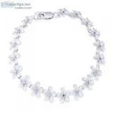 14K White Gold Plumeria Bracelet With 18 Blue Diamonds