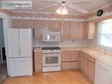 Bleached Oak Kitchen Cabinets All Appliances and Corian Counter 