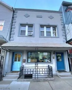 Come see this multi-family home with a business studio in the he