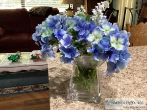 Vase with blue flower arrangement