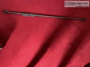 Black metal extending curtain pole