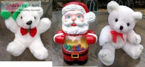 Two small holiday teddy bears and Santa rolling toy