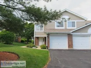 Gorgeous light-filled end unit ranch style townhome with private