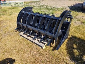 Skid steer grapple root rake brush