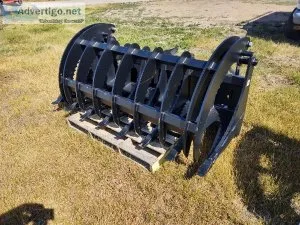 Skid steer grapple root rake brush