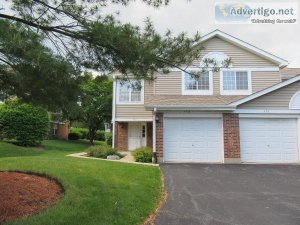 Gorgeous light-filled end unit ranch style townhome with private