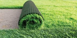 What makes artificial turf a reliable outdoor option?