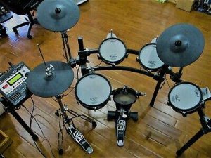 Letting a baby grand piano and e-drum set going for free