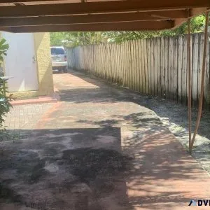 Parking space storage for a car under carport .