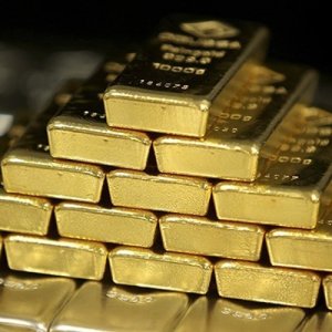 Gold nuggets and bars on sale