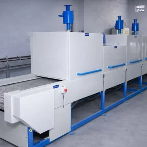 Flat belt ovens for continuous industrial processing